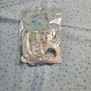 Bag of colorful ribbons on a blue background.