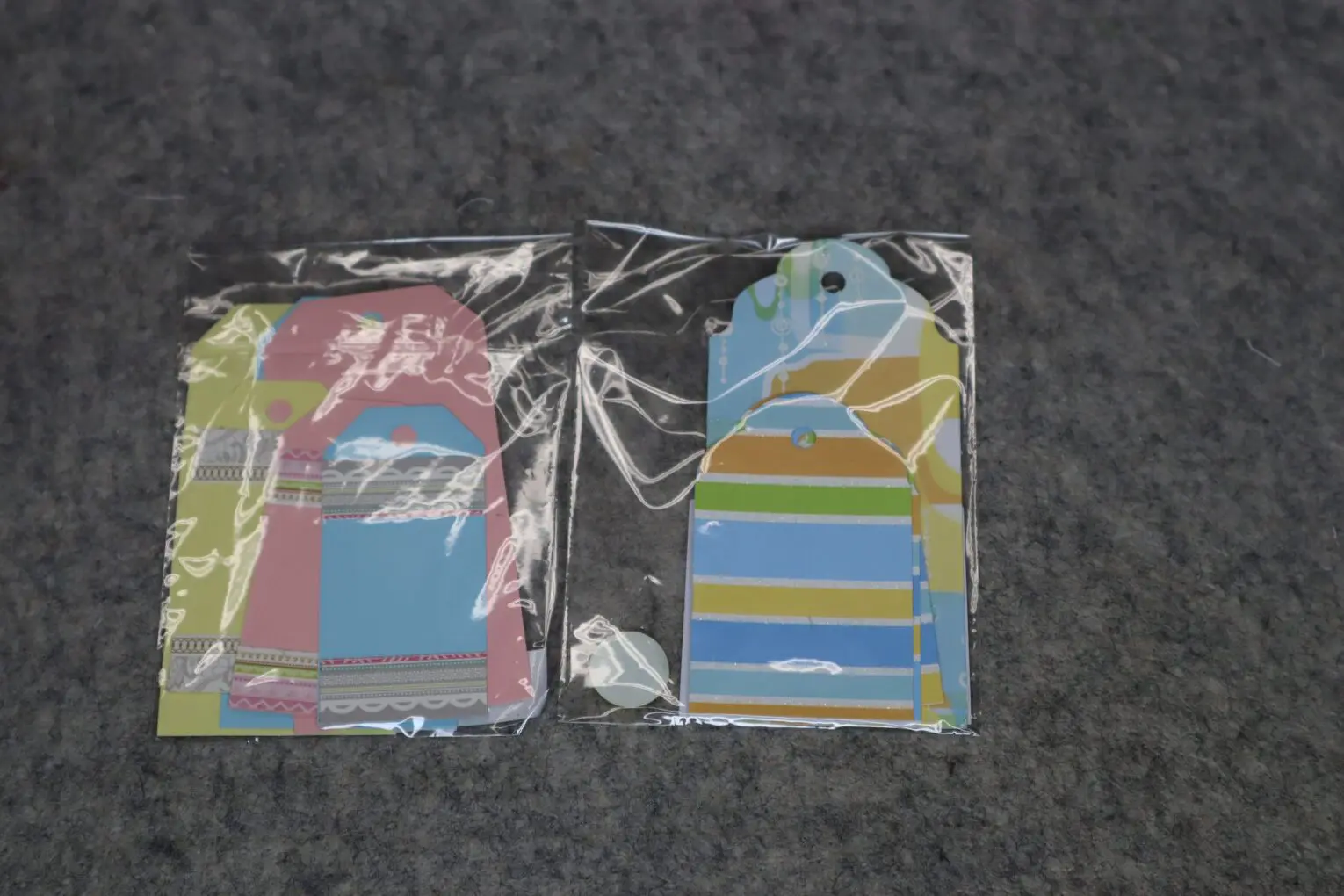 Colorful gift tags packaged in clear plastic.