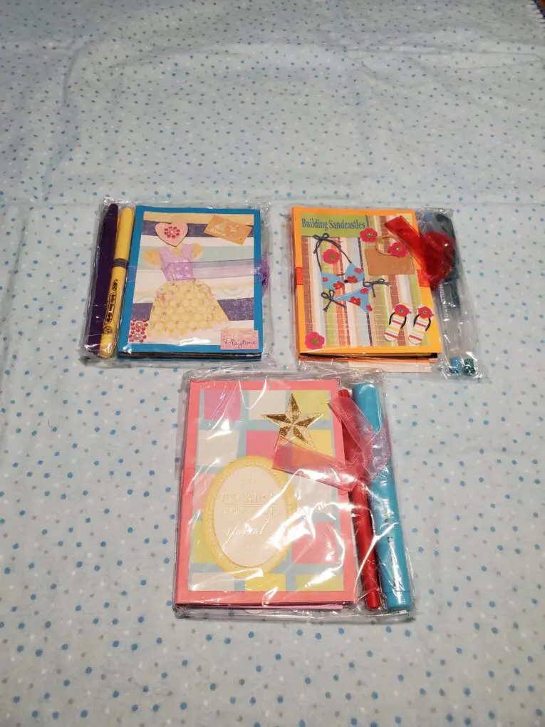 Colorful stationery sets packaged with decorative designs.