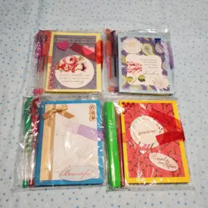 Colorful stationery sets packaged with decorative ribbons.
