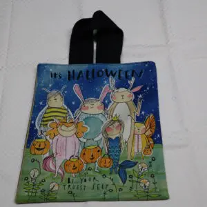 Halloween-themed fabric bag with whimsical bunny characters and pumpkins.