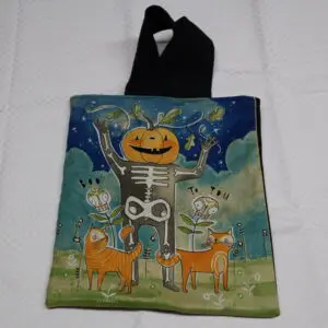 Halloween-themed tote bag with skeleton and pumpkins design.