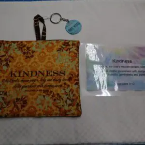 A kindness-themed pouch with a keychain and an inspirational card.