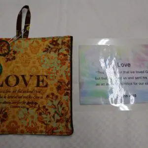 Decorative hanging plaque with the word 'LOVE' and a matching card.