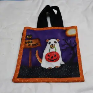 Halloween-themed tote bag with a ghost and pumpkin design.
