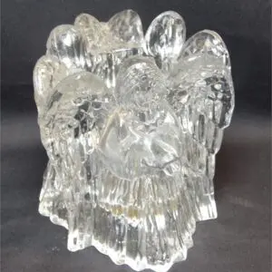 Clear glass sculpture resembling a flower or coral.