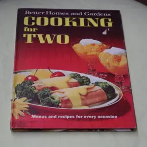 Cover of a cookbook titled 'Cooking for Two' with food images.