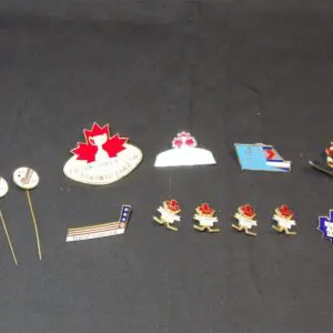A collection of Canadian-themed lapel pins and badges.