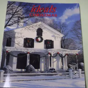 Snow-covered house decorated for Christmas with wreaths and lights.