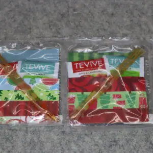 Two packets of Teyva brand sweet chili sauce in plastic wrappers.