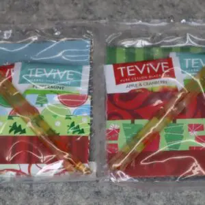Two packets of Teyva brand sweet chili sauce in plastic wrappers.