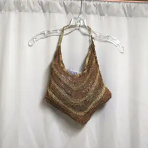 Handmade crochet halter top with earth-tone stripes hanging on a clear hanger.