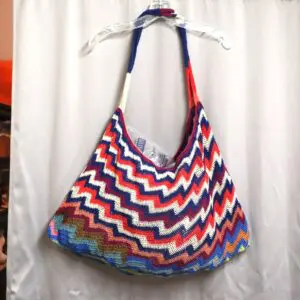 Colorful zigzag patterned tote bag with shoulder straps.
