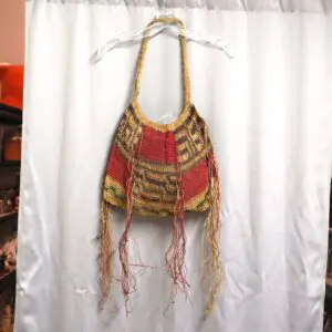 Handcrafted beaded Native American-style bag with intricate patterns and fringes.