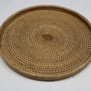 Handwoven round wicker tray with natural brown tones.