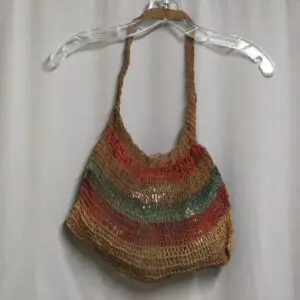 Handmade multicolored woven handbag with a shoulder strap.