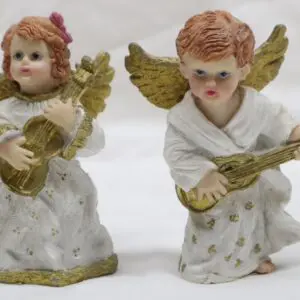 Two ceramic angel figurines playing musical instruments.