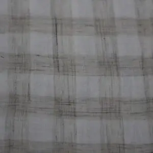 Close-up of a light plaid fabric with subtle beige and gray tones.