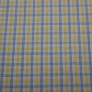 Close-up of a blue and yellow checkered fabric pattern.