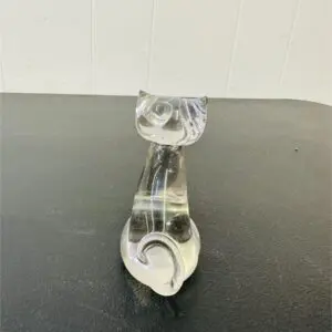 Clear glass cat figurine with a heart-shaped detail at the base.