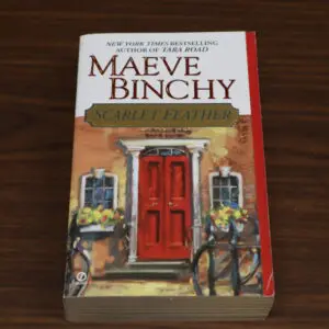 Paperback of Maeve Binchy's novel 'Scarlet Feather' with a red door on the cover.