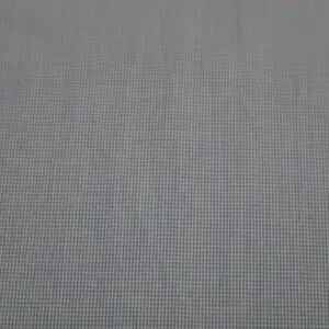 Close-up of a light blue textured fabric with a grid pattern.