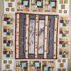 A colorful quilt with intricate patterns and patchwork borders.
