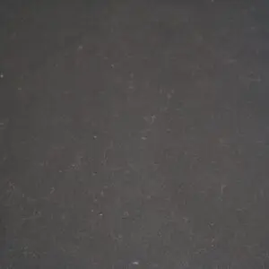 A plain, dark gray textured surface.