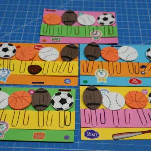 Colorful handmade bookmarks with sports-themed designs featuring soccer and basketball.