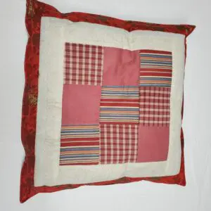 Patchwork pillow with red border
