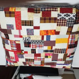 Colorful patchwork quilt draped over bed