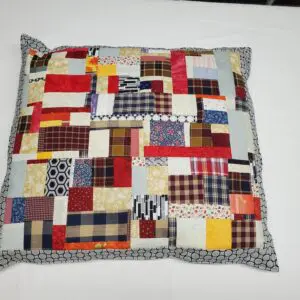 Patchwork pillow with multicolored fabric squares