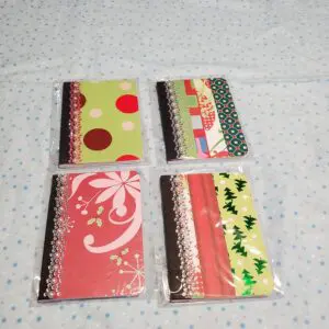 Colorful decorative notebooks with unique patterns displayed.