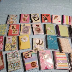 Assorted decorative notebooks with vibrant covers displayed.