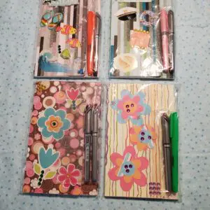Colorful stationery sets with decorative designs.