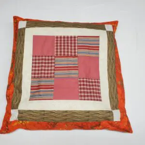 Colorful patchwork cushion with paw prints
