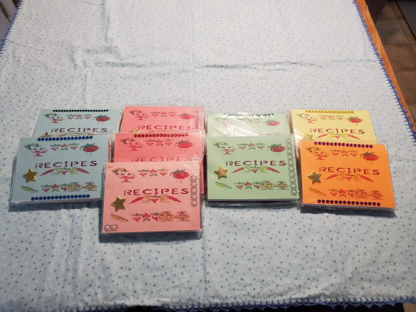 Colorful recipe cards arranged on a blue table.