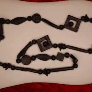 Black beaded necklace with various geometric shapes.