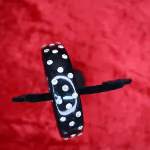 Black bracelet adorned with sparkling rhinestones.