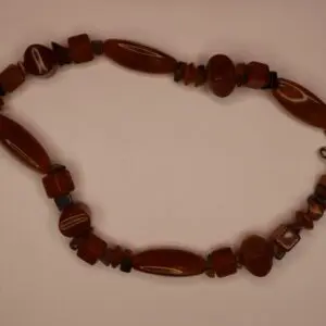 Brown beaded necklace with unique shapes and textures.