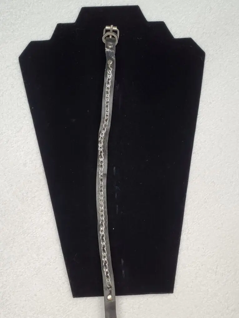 Leather strap with chain detail displayed flat.