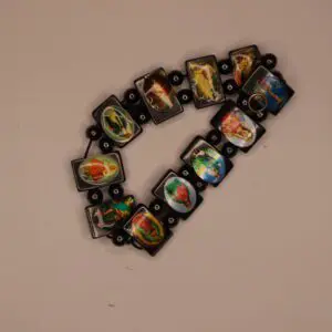 Colorful bracelet featuring artistic image tiles.