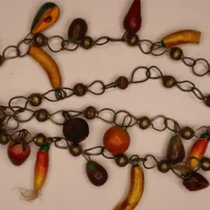 Colorful fruit-shaped beads on a chain.