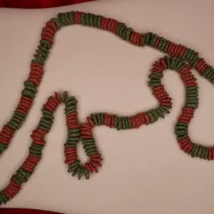 Colorful necklace featuring red and green beads.