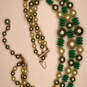 Green and pearl beaded necklace with unique design.