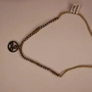 Handmade bracelet with peace symbol charm.