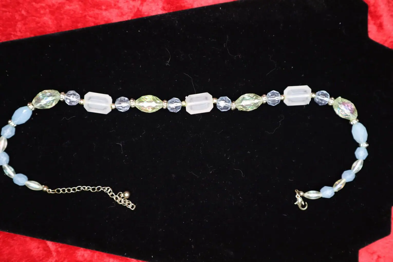 Colorful beaded bracelet with unique shapes displayed.
