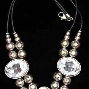 Silver and crystal beaded necklace with unique design.