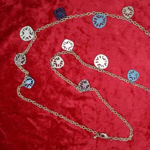 Colorful chain necklace with patterned metal discs.