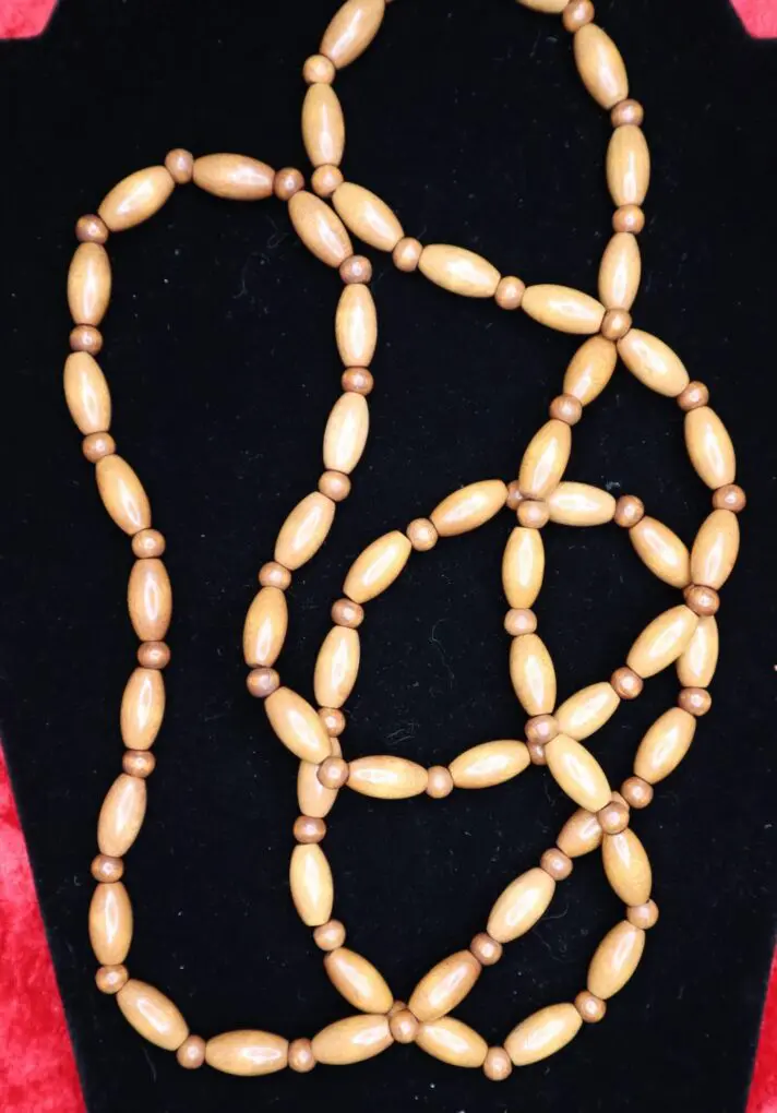 Natural wooden bead necklace with elegant design.